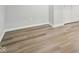 Minimalist bedroom featuring hardwood floors, baseboard trim, and neutral paint at 8015 Sargent Rdg, Indianapolis, IN 46256