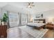 Spacious bedroom featuring hardwood floors, large windows, and a cozy, inviting atmosphere at 8015 Sargent Rdg, Indianapolis, IN 46256