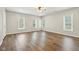 Bright, open bedroom with hardwood floors and several large windows at 8015 Sargent Rdg, Indianapolis, IN 46256