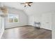 Bedroom boasting a ceiling fan, wood floors, double closets, and bright window at 8015 Sargent Rdg, Indianapolis, IN 46256