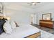 Bright bedroom with wood floors, a large window, and stylish furnishings at 8015 Sargent Rdg, Indianapolis, IN 46256