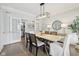 Bright dining room featuring a stylish table and chairs, modern decor, and hardwood floors at 8015 Sargent Rdg, Indianapolis, IN 46256