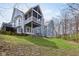 Back exterior features a screened in porch, walk out basement, and lush yard at 8015 Sargent Rdg, Indianapolis, IN 46256