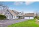 Spacious home with three-car garage, light-blue siding, and well-manicured lawn and mature trees at 8015 Sargent Rdg, Indianapolis, IN 46256
