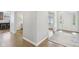 Inviting foyer with hardwood floors, neutral paint, and a view into other rooms at 8015 Sargent Rdg, Indianapolis, IN 46256