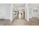 Grand foyer with hardwood floors, stylish decor, and open access to multiple rooms at 8015 Sargent Rdg, Indianapolis, IN 46256