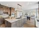 Spacious kitchen with large island, granite countertops, stainless appliances, and wood floors at 8015 Sargent Rdg, Indianapolis, IN 46256