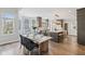 Bright kitchen and dining area with an island, modern appliances, and ample counter space at 8015 Sargent Rdg, Indianapolis, IN 46256