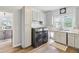 Laundry room with modern washer and dryer, white cabinets, and a utility sink at 8015 Sargent Rdg, Indianapolis, IN 46256
