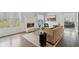 Bright living room features a cozy fireplace and ample natural light from large windows at 8015 Sargent Rdg, Indianapolis, IN 46256