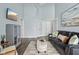 Inviting living room featuring a comfortable sofa, stylish decor, and ample natural light at 8015 Sargent Rdg, Indianapolis, IN 46256