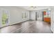 Inviting living room with natural light, wood floors and outdoor access at 8015 Sargent Rdg, Indianapolis, IN 46256