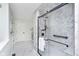Walk-in shower with glass door and shower head is next to a bathroom with a sink at 8061 Lower Bay Ln # 1, Indianapolis, IN 46236
