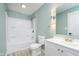Bathroom with a tub-shower and sleek white vanity, neutral color and modern fixtures at 8061 Lower Bay Ln # 1, Indianapolis, IN 46236