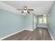 Bedroom with wood floors, natural lighting, and neutral paint at 8061 Lower Bay Ln # 1, Indianapolis, IN 46236