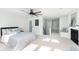 This bedroom includes a ceiling fan, sitting area, and fireplace at 8061 Lower Bay Ln # 1, Indianapolis, IN 46236