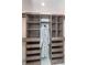 Spacious walk-in closet featuring ample shelving, drawers, and hanging space at 8061 Lower Bay Ln # 1, Indianapolis, IN 46236