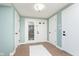 Bright entryway featuring tile flooring and a storm door allowing natural light to enter at 8061 Lower Bay Ln # 1, Indianapolis, IN 46236