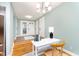 Inviting entryway with hardwood floors and a charming view of the kitchen area at 8061 Lower Bay Ln # 1, Indianapolis, IN 46236