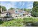 Gorgeous exterior view of a blue house with a gazebo, deck, and waterfront at 8061 Lower Bay Ln # 1, Indianapolis, IN 46236
