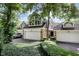 Exterior view of a home with attached two-car garages and well-maintained landscaping at 8061 Lower Bay Ln # 1, Indianapolis, IN 46236