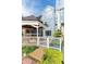 Backyard view of a blue house with a charming gazebo, deck, and lush landscaping at 8061 Lower Bay Ln # 1, Indianapolis, IN 46236