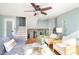 Open-concept living area with staircase, stylish furnishings, and ample natural light at 8061 Lower Bay Ln # 1, Indianapolis, IN 46236