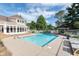 Community pool area with lounge chairs, a gazebo, and a well-maintained deck at 8061 Lower Bay Ln # 1, Indianapolis, IN 46236