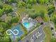 Aerial view of the property with a community pool and tennis courts at 9080 Dewberry Ct, Indianapolis, IN 46260