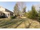 Expansive backyard with a screened-in porch and mature trees at 9080 Dewberry Ct, Indianapolis, IN 46260