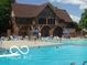 Community pool with diving board and seating available for residents at 9080 Dewberry Ct, Indianapolis, IN 46260