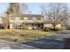 Two-story house with stone accents, solar panels, covered front porch, and driveway at 9080 Dewberry Ct, Indianapolis, IN 46260