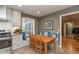 Eat-in kitchen features built-in bench seating and stainless steel appliances at 9080 Dewberry Ct, Indianapolis, IN 46260