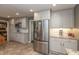 Spacious kitchen features stainless steel refrigerator and ample cabinet space at 9080 Dewberry Ct, Indianapolis, IN 46260