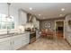 Bright, updated kitchen with stainless steel appliances, granite countertops, and adjacent breakfast nook at 9080 Dewberry Ct, Indianapolis, IN 46260