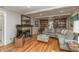 Cozy living room with wood floors, fireplace, and built-in bookshelves at 9080 Dewberry Ct, Indianapolis, IN 46260