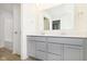 Bright bathroom with a double sink vanity, granite counters and a shower and tub at 9730 Behner Dr, Fishers, IN 46250