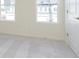 Bedroom featuring carpet floor, and two windows overlooking the community at 9730 Behner Dr, Fishers, IN 46250
