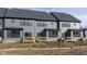 New construction townhome with a wood deck ready for customization and landscaping at 9730 Behner Dr, Fishers, IN 46250