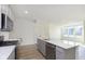 Bright kitchen with stainless steel appliances, gas range, and large center island at 9730 Behner Dr, Fishers, IN 46250
