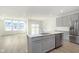 Open concept kitchen featuring stainless steel appliances and a center island with a sink and dishwasher at 9730 Behner Dr, Fishers, IN 46250