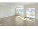 Spacious living room featuring large windows and sliding glass doors leading to the outside deck at 9730 Behner Dr, Fishers, IN 46250