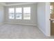 Bright bedroom with neutral carpet and natural light from the large windows offering expansive views at 9742 Behner Dr, Fishers, IN 46250