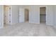Spacious bedroom with neutral carpet, multiple closets, and natural light at 9742 Behner Dr, Fishers, IN 46250