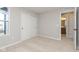 Bright bedroom showcasing a window, closet, and doorway to the ensuite bathroom at 9742 Behner Dr, Fishers, IN 46250