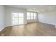 Spacious living area with sliding glass doors, hardwood floors, and large windows, perfect for entertaining guests at 9742 Behner Dr, Fishers, IN 46250