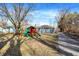 Large backyard with a playset, picnic table and mature trees at 1195 W Edgewood Ave, Indianapolis, IN 46217