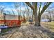 The expansive backyard features a playset, picnic table, shed and covered deck at 1195 W Edgewood Ave, Indianapolis, IN 46217