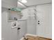 Unfinished basement area with white storage shelves, a new floor and utility hook-ups at 1195 W Edgewood Ave, Indianapolis, IN 46217