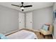 Bedroom with a ceiling fan, and a brightly decorated accent chair at 1195 W Edgewood Ave, Indianapolis, IN 46217
